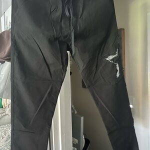 Woman’s Black Pants with Embroidered Silver Star Detail